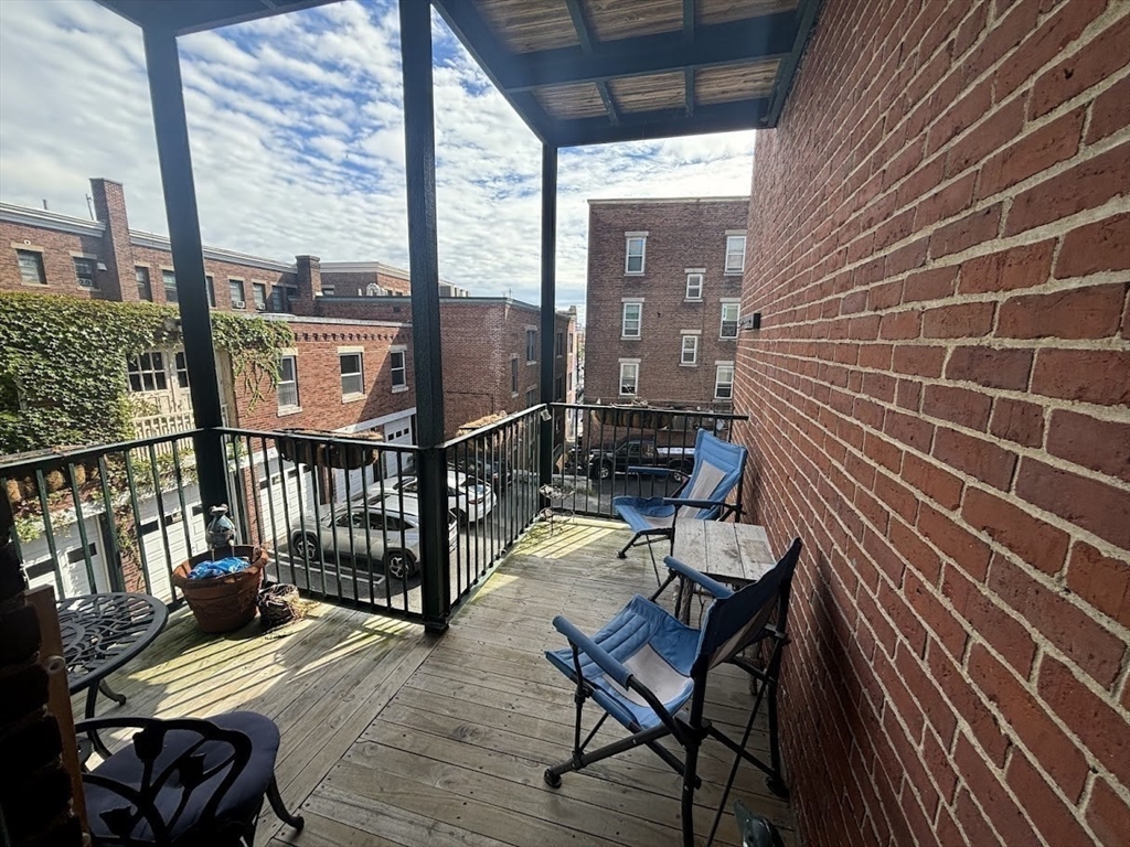 1 Harbor Street, Unit 1 Salem, MA 01970 - Photo 6 of 7 a view of a balcony with chairs
