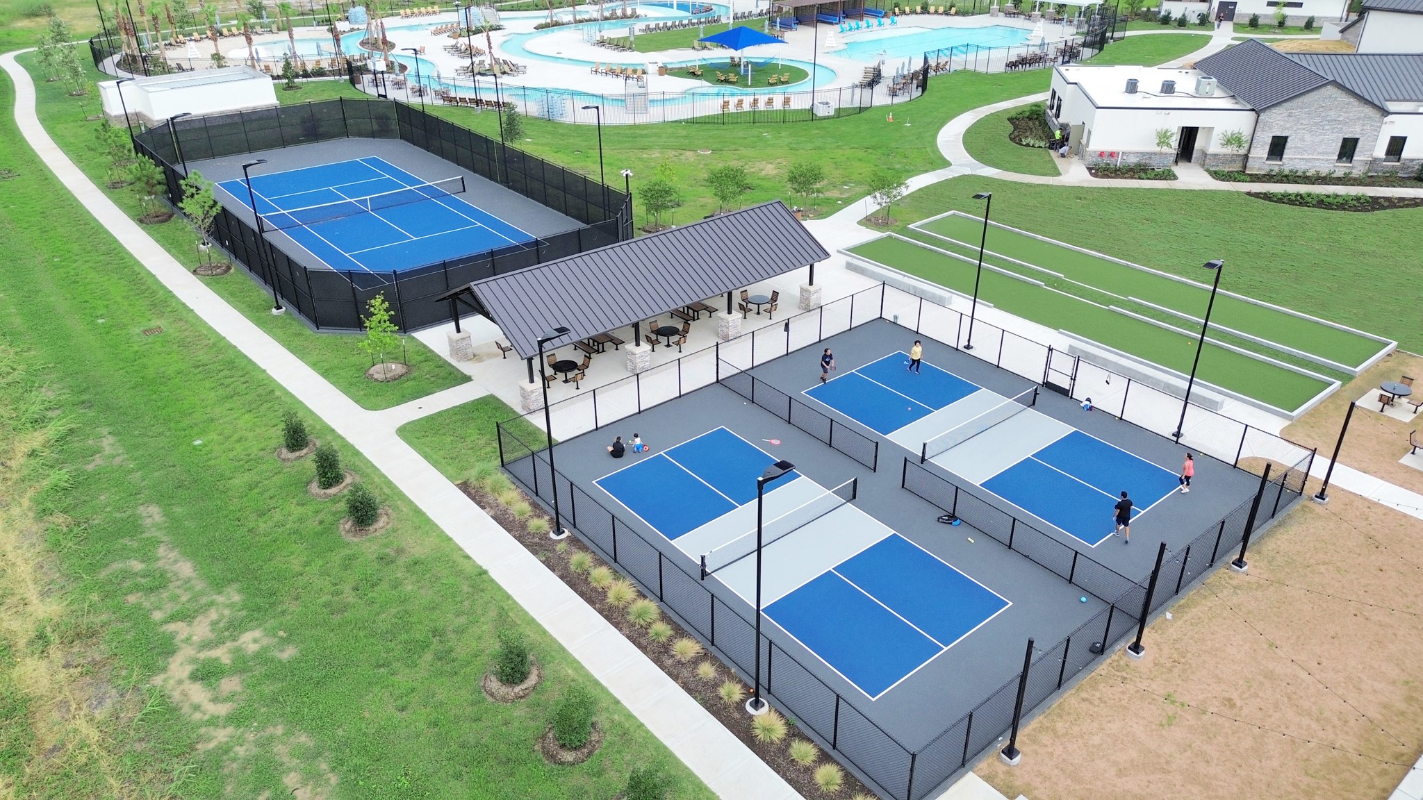 10314 Tuscan Valley Drive, Unit A Rosharon, TX 77583 - Photo 44 of 50 For relaxation and recreation residents can enjoy the Resort Style Amenity Village offering:Heated Lazy River,Resort Style Pool,Splash Pad,Playground,Multiple Sports Courts-Basketball,Pickleball,Bocce Ball,Tennis,Sports Field,Sand Beach,Cabana & Hammock area, Clubhouse with Fitness Center,Lounge,Great Room & Outdoor Pavillon.