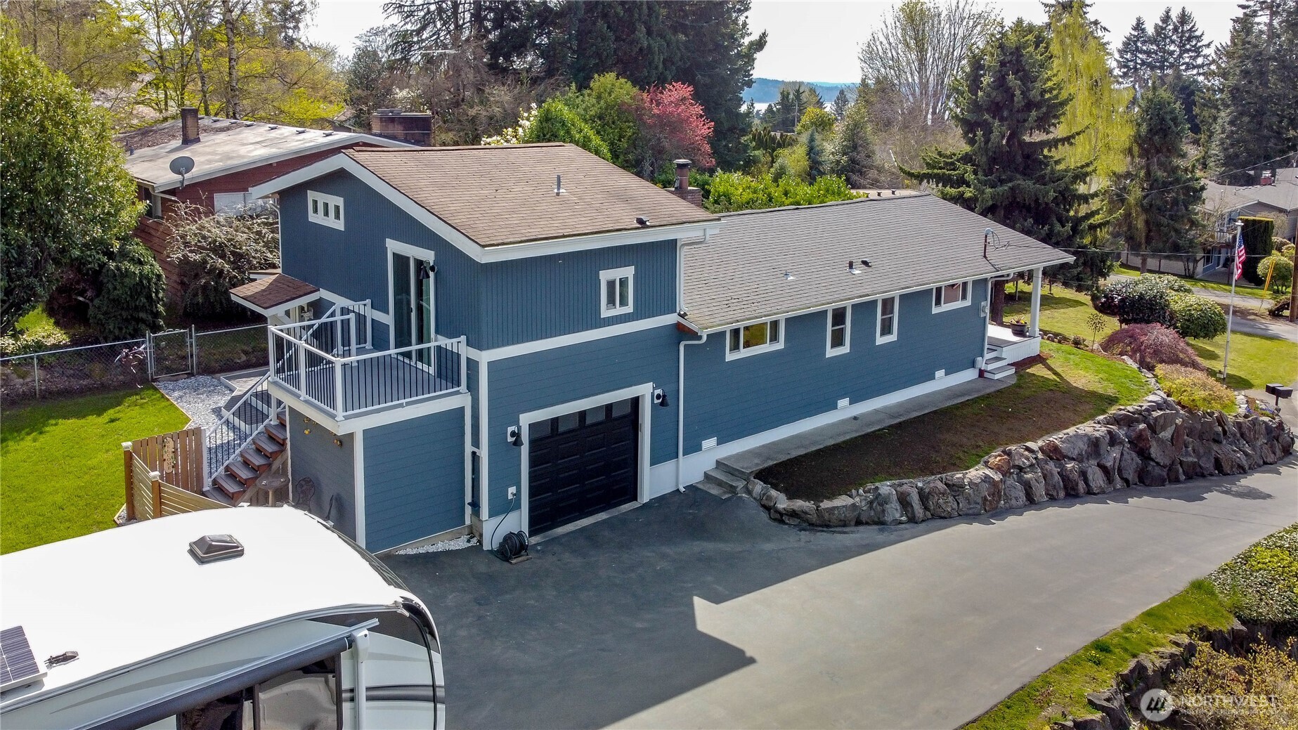 215 Southwest 183rd Street Normandy Park, WA 98166 - Photo 1 of 31 a view of a house with a yard and sitting area