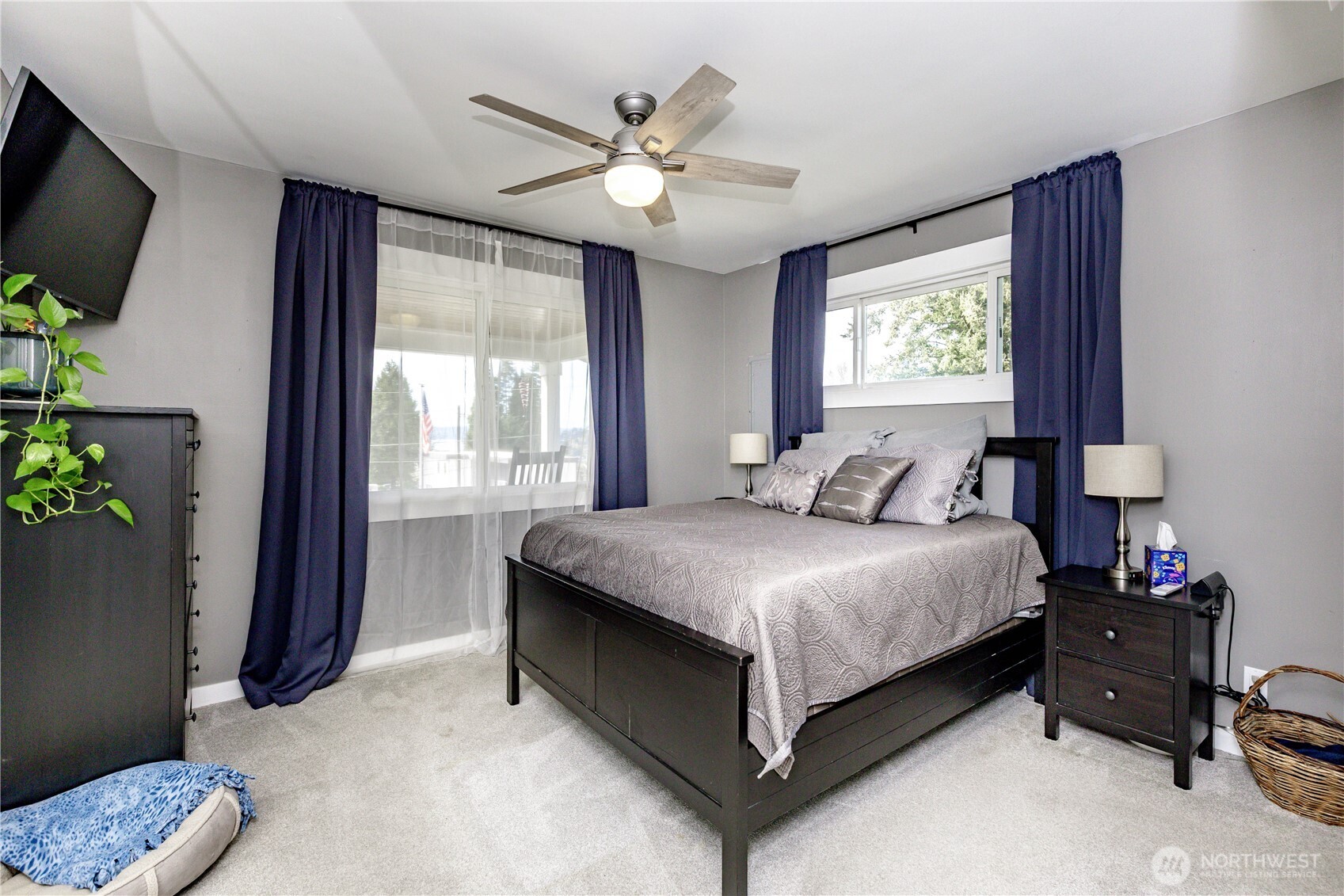 215 Southwest 183rd Street Normandy Park, WA 98166 - Photo 14 of 31 a bedroom with a bed and a chandelier