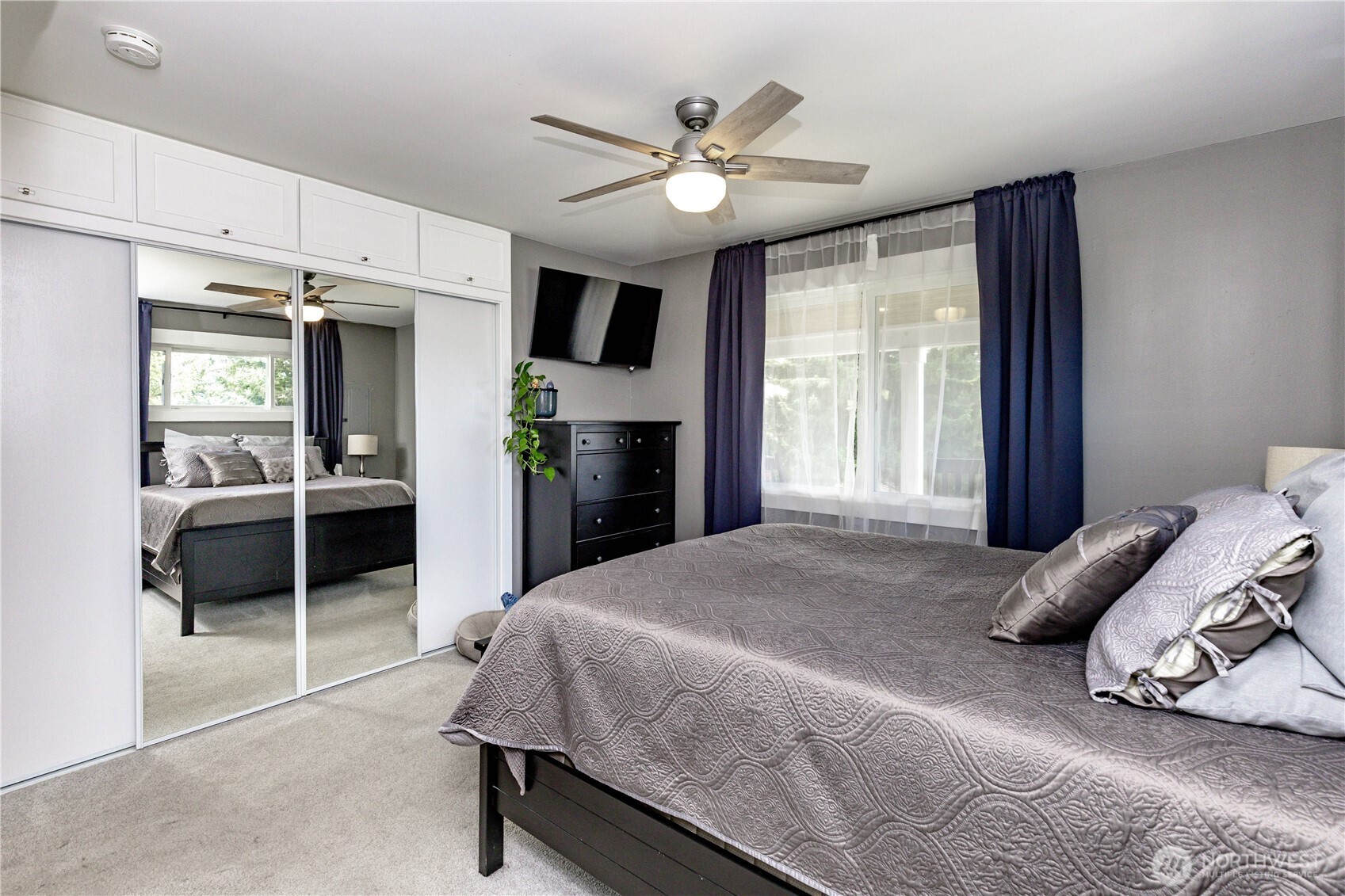215 Southwest 183rd Street Normandy Park, WA 98166 - Photo 15 of 31 a bedroom with a large bed and a window