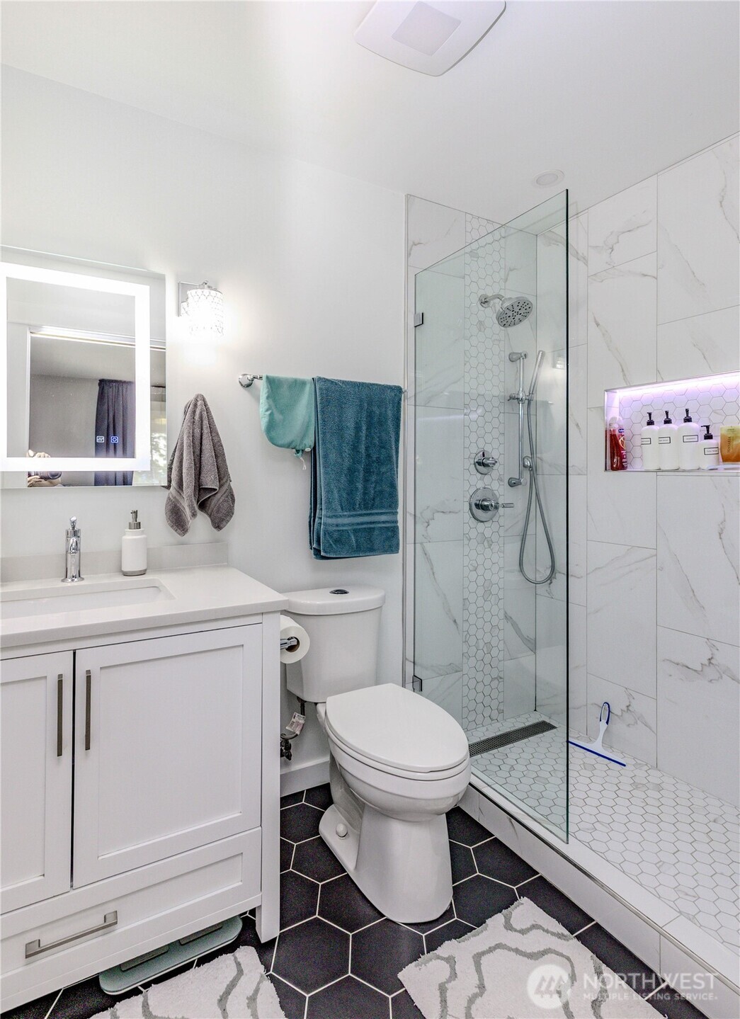 215 Southwest 183rd Street Normandy Park, WA 98166 - Photo 16 of 31 a bathroom with a sink toilet and shower