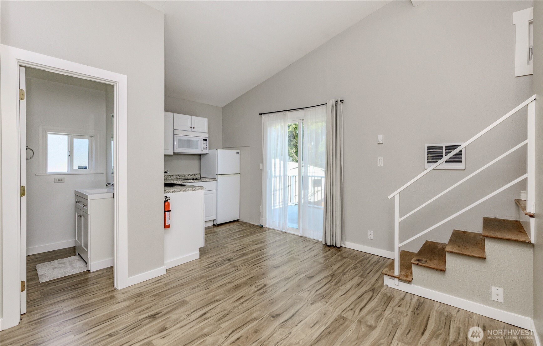 215 Southwest 183rd Street Normandy Park, WA 98166 - Photo 18 of 31 a view of kitchen and wooden floor