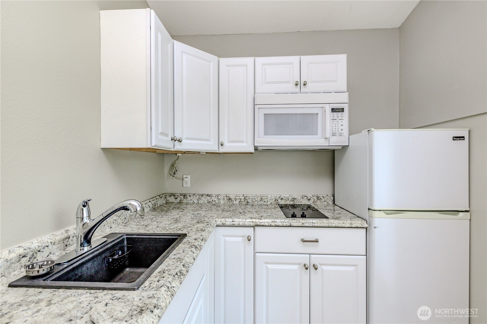 215 Southwest 183rd Street Normandy Park, WA 98166 - Photo 19 of 31 a kitchen with white cabinets and a sink