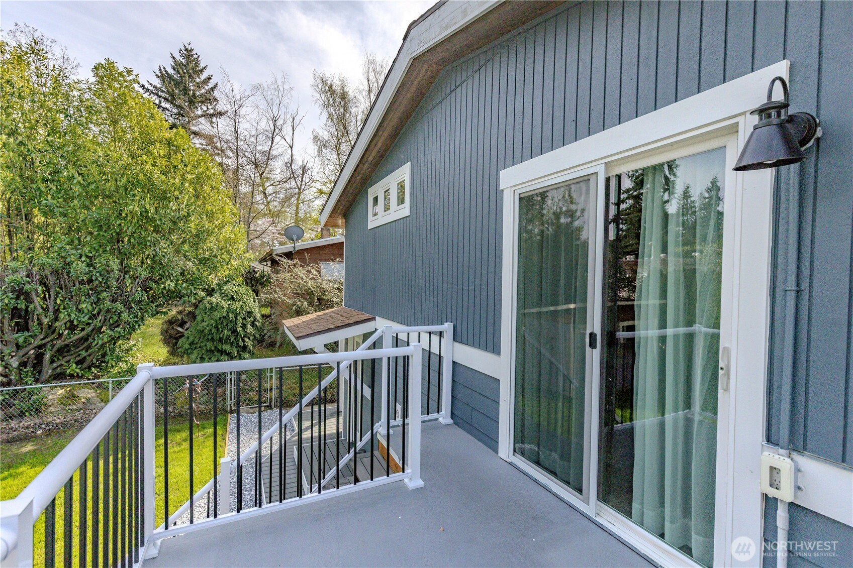 215 Southwest 183rd Street Normandy Park, WA 98166 - Photo 23 of 31 a view of a house with backyard and porch