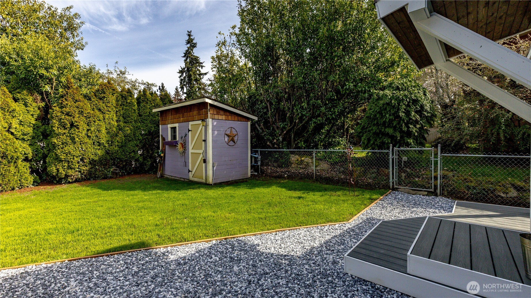 215 Southwest 183rd Street Normandy Park, WA 98166 - Photo 26 of 31 a view of a backyard with a garden