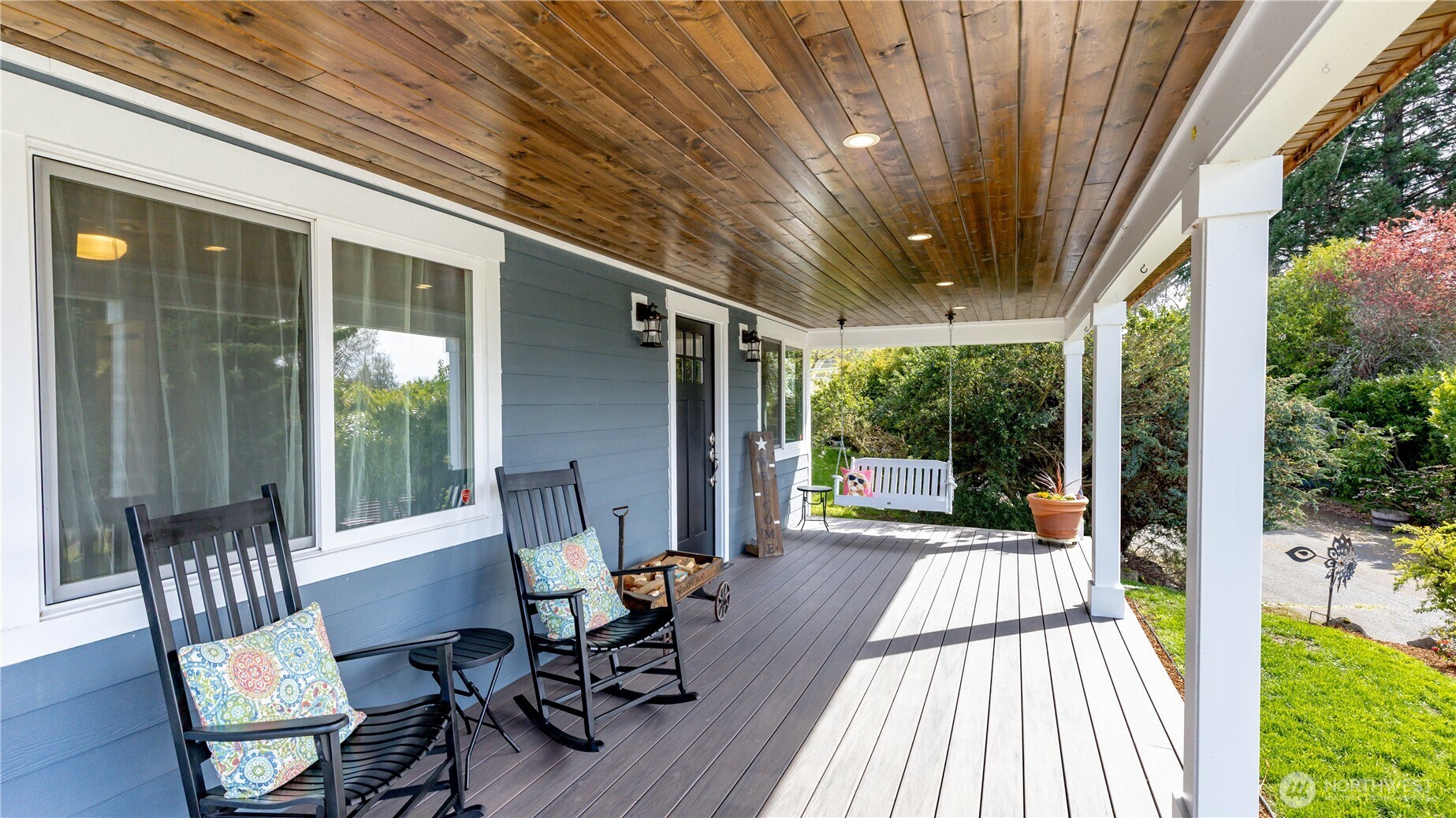 215 Southwest 183rd Street Normandy Park, WA 98166 - Photo 4 of 31 a view of a patio with table and chairs and wooden floor