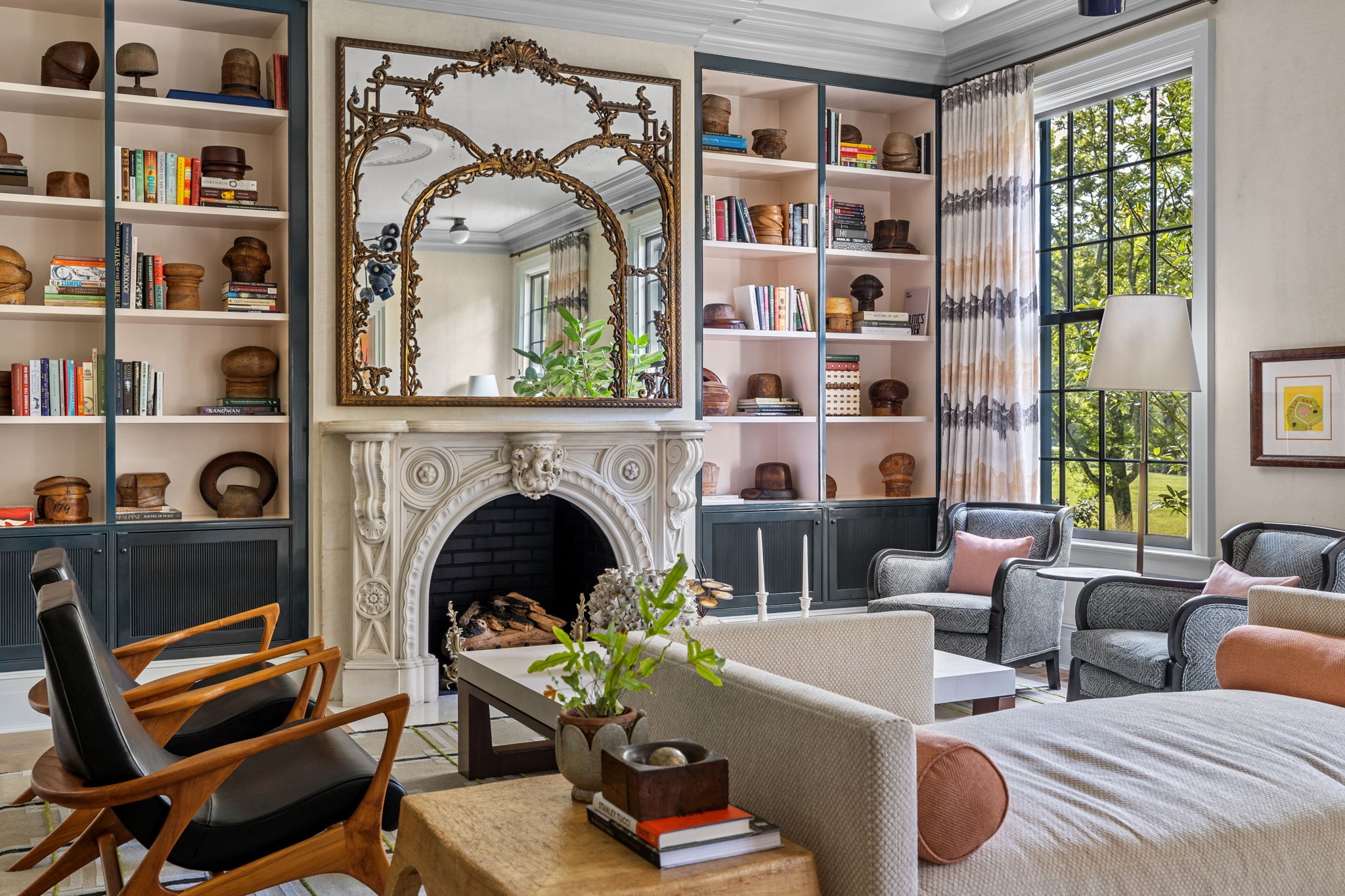 a living room with furniture and a fireplace