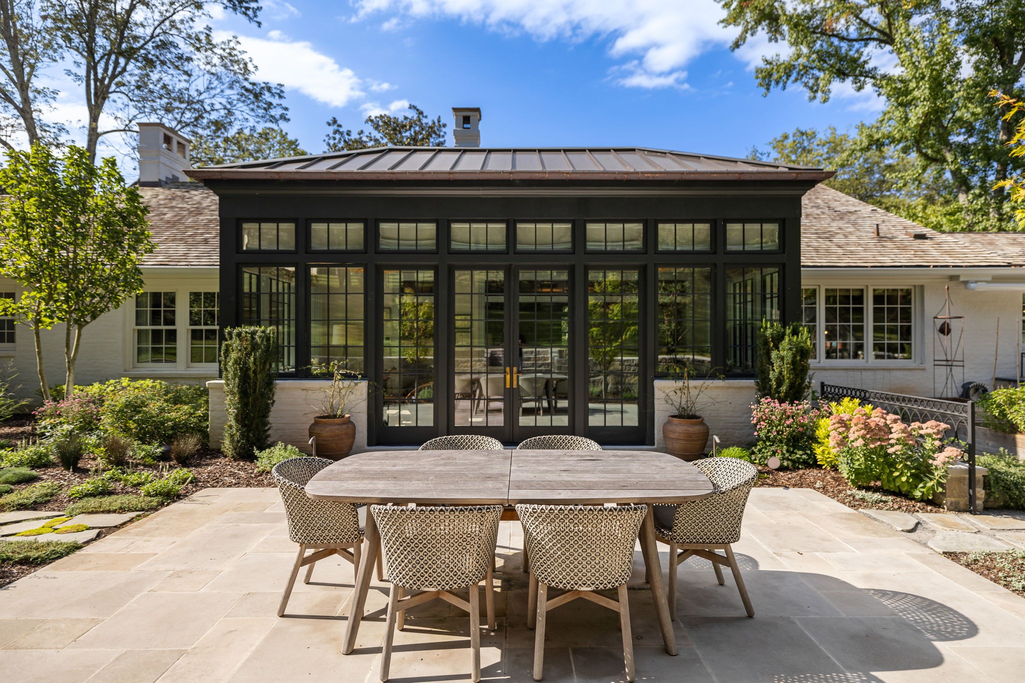 1410 Chickering Road Nashville, TN 37215 - Photo 25 of 68 a view of a patio with a table and chairs under an umbrella