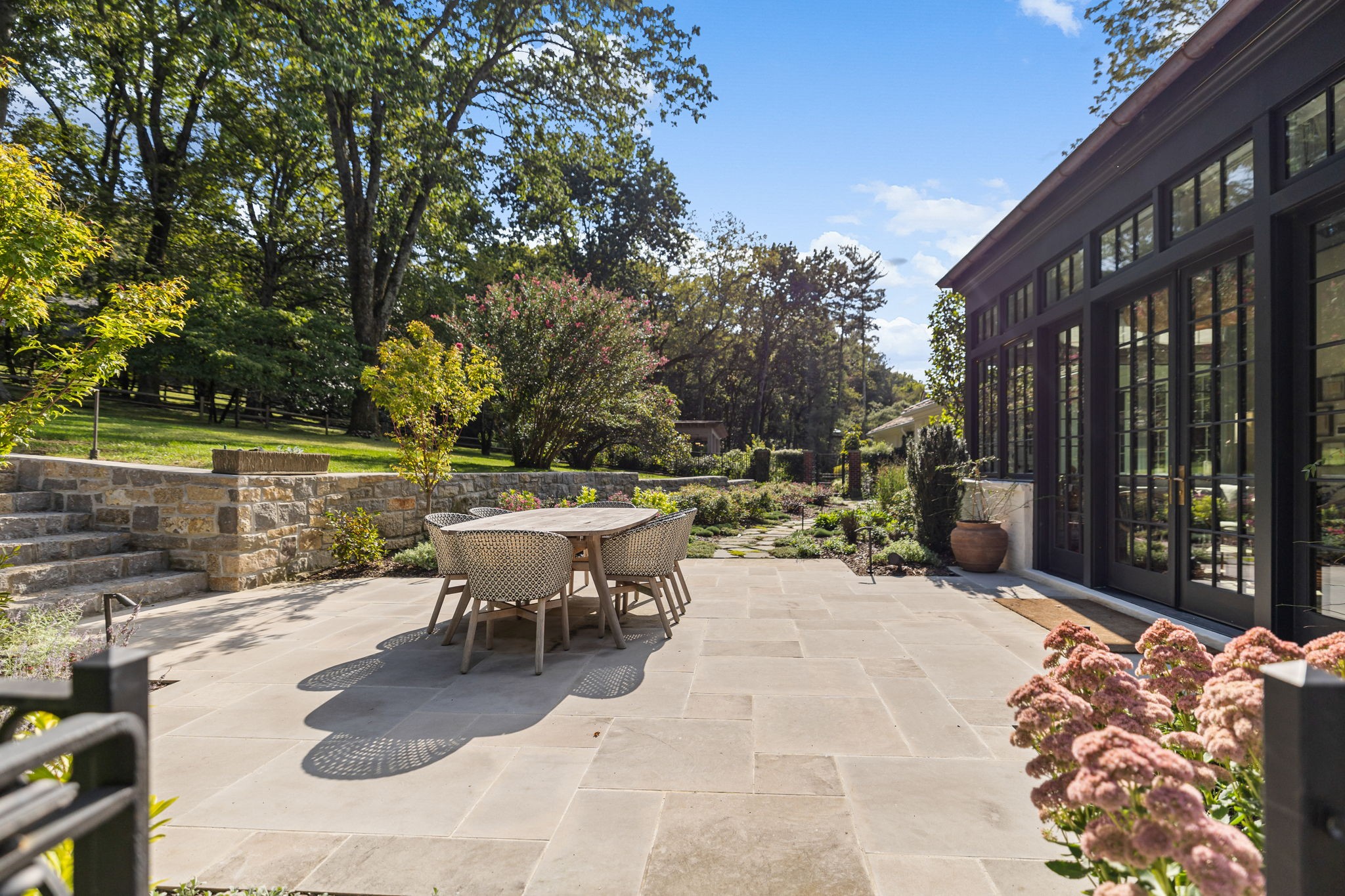 1410 Chickering Road Nashville, TN 37215 - Photo 26 of 68 a view of a patio with a table and chairs under an umbrella