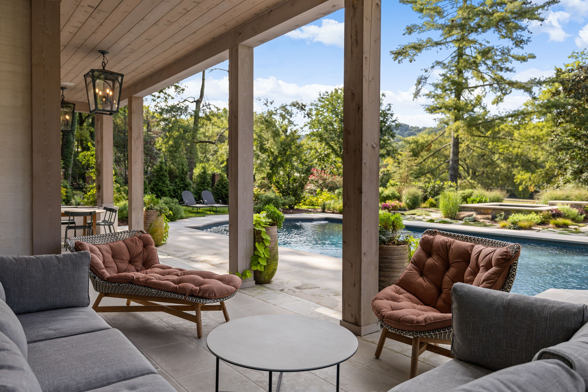 1410 Chickering Road Nashville, TN 37215 - Photo 50 of 68 a outdoor living space with patio couch and a garden