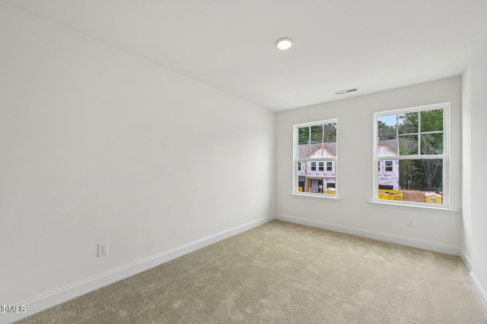 804 Kensley Grv Lane Fuquay-Varina, NC 27526 - Photo 13 of 28 an empty room with windows