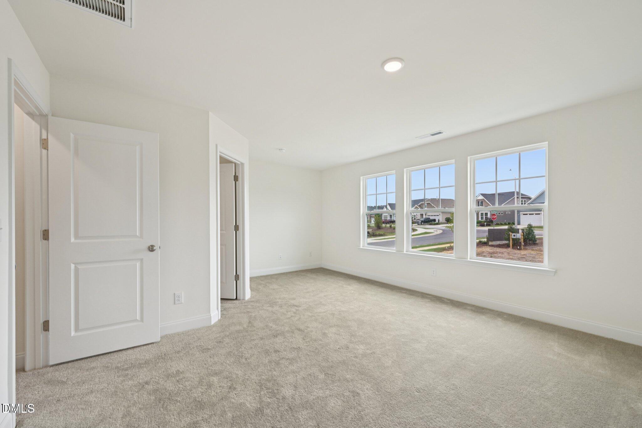 804 Kensley Grv Lane Fuquay-Varina, NC 27526 - Photo 16 of 28 a view of an empty room with a window