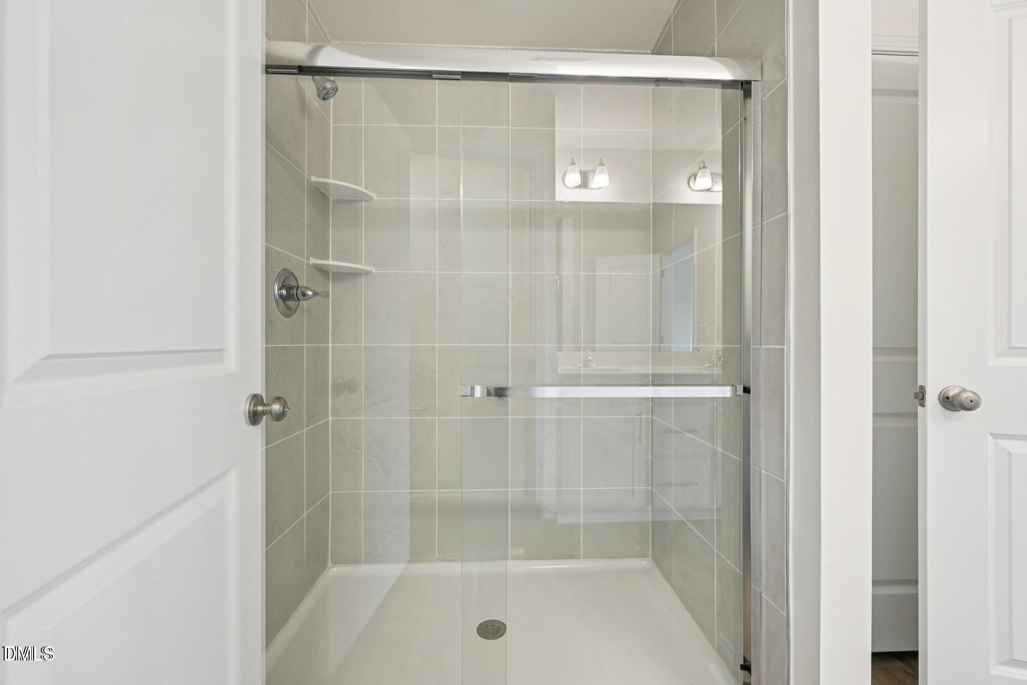 804 Kensley Grv Lane Fuquay-Varina, NC 27526 - Photo 20 of 28 a bathroom with a shower