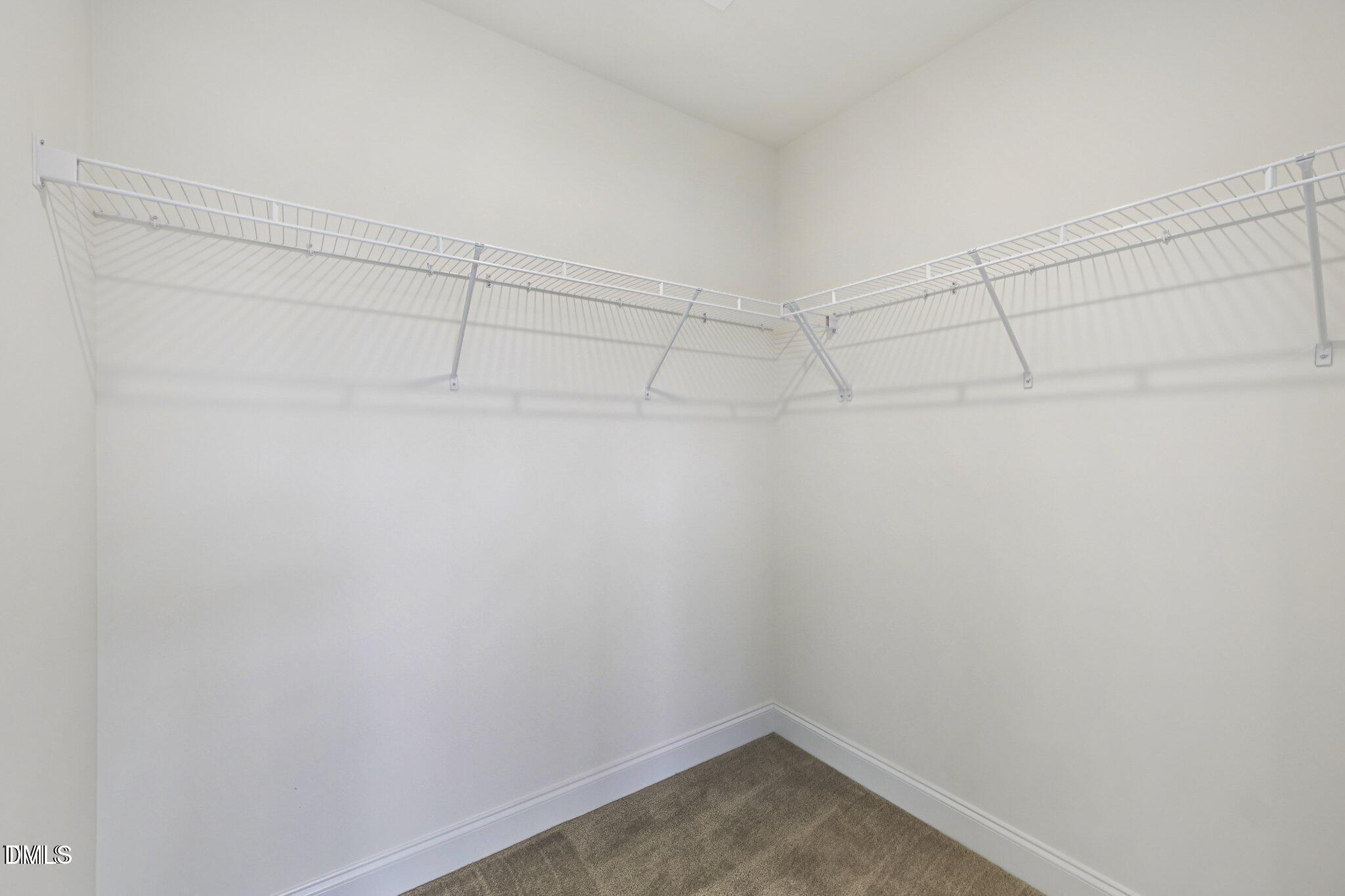 804 Kensley Grv Lane Fuquay-Varina, NC 27526 - Photo 21 of 28 a view of a room with racks on the wall