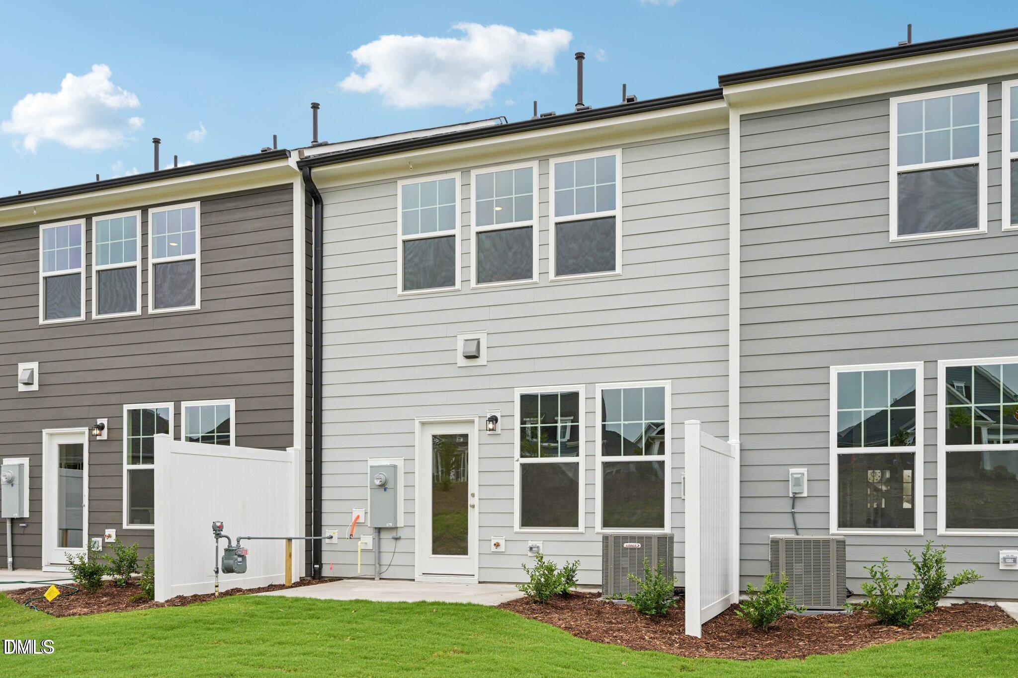 804 Kensley Grv Lane Fuquay-Varina, NC 27526 - Photo 23 of 28 a front view of a house with a yard