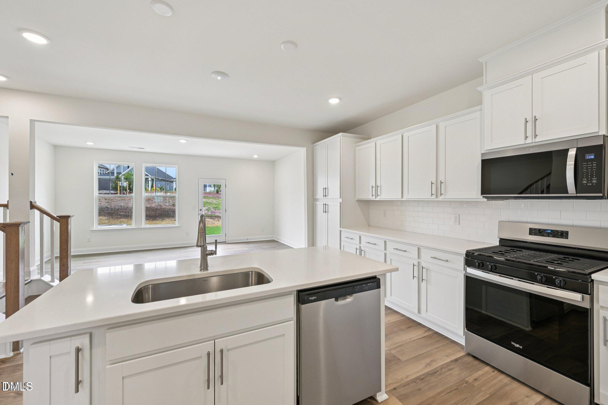 804 Kensley Grv Lane Fuquay-Varina, NC 27526 - Photo 10 of 28 a kitchen with sink a microwave and cabinets