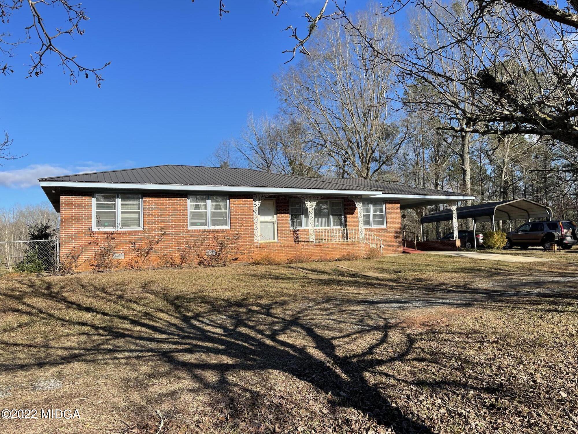 a view of a house with a big yard