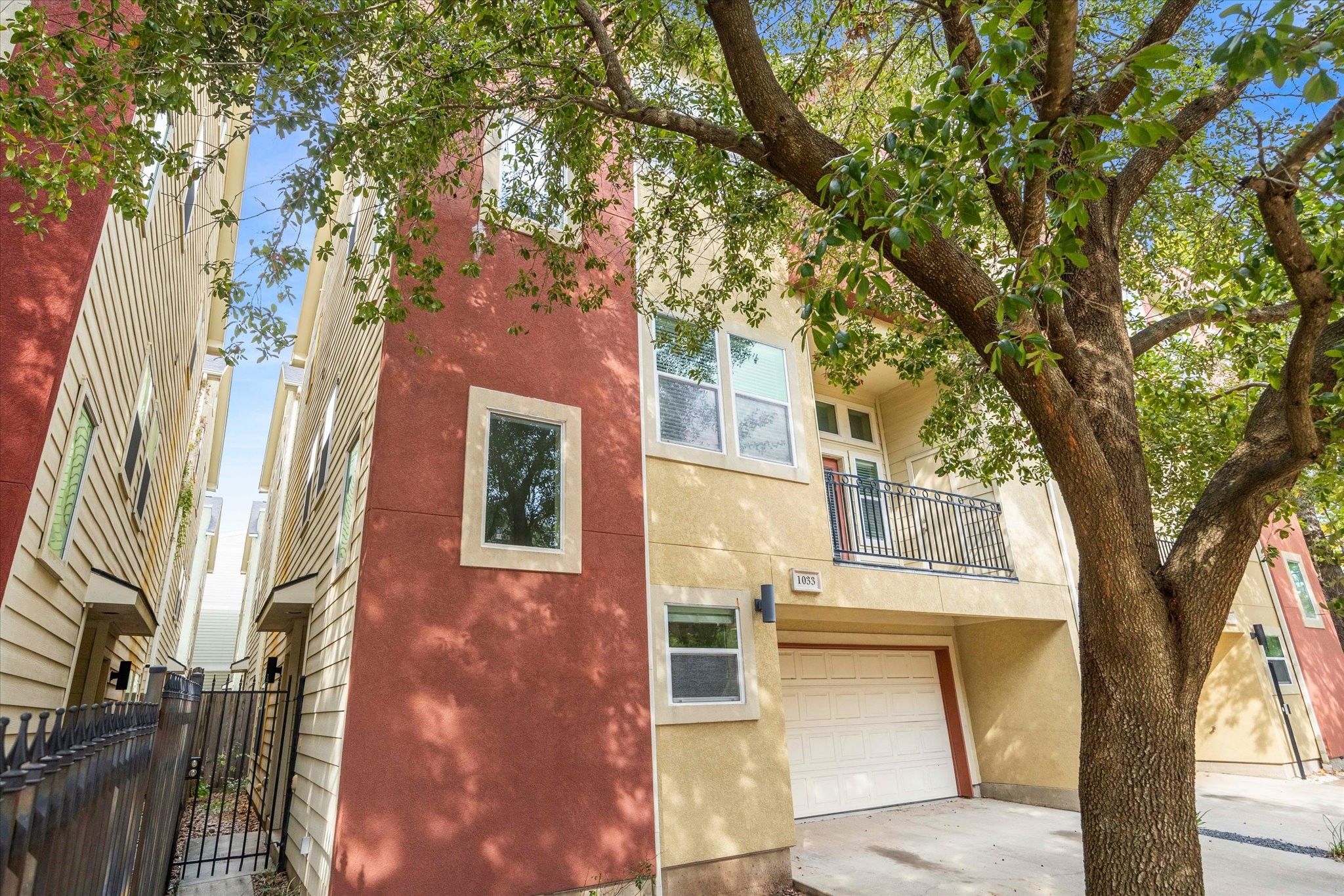 a view of a house with a tree