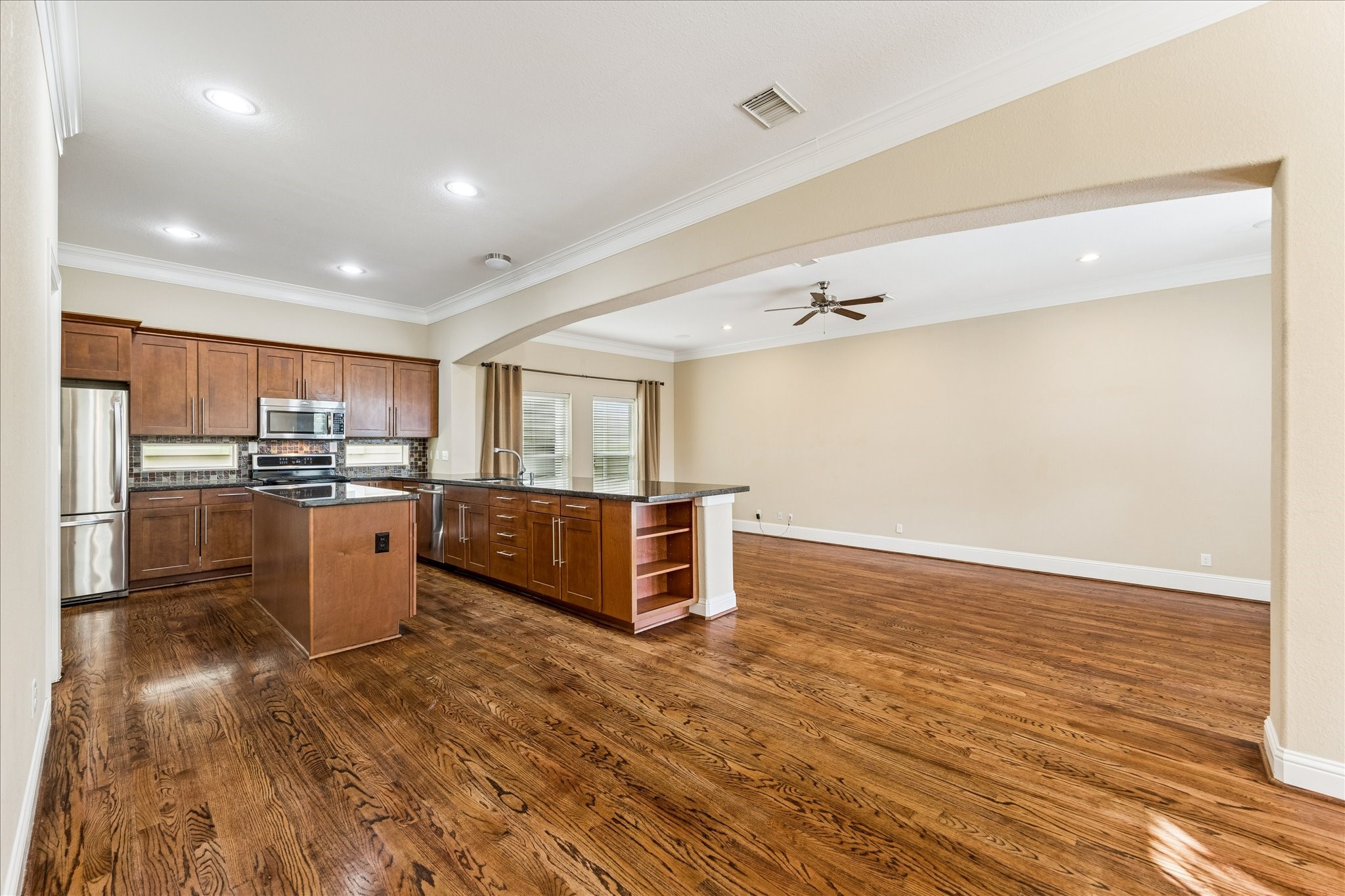 1033 West 23rd Street Houston, TX 77008 - Photo 11 of 26 a kitchen with a sink and refrigerator