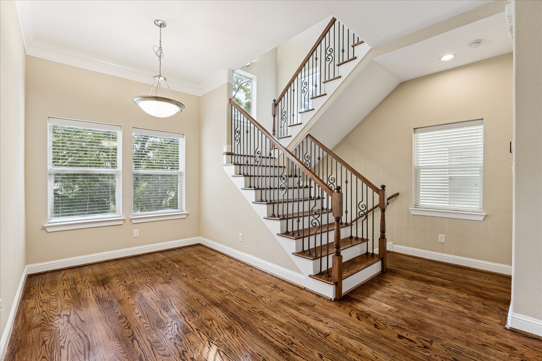 1033 West 23rd Street Houston, TX 77008 - Photo 15 of 26 a view of entryway with wooden floor and stairs