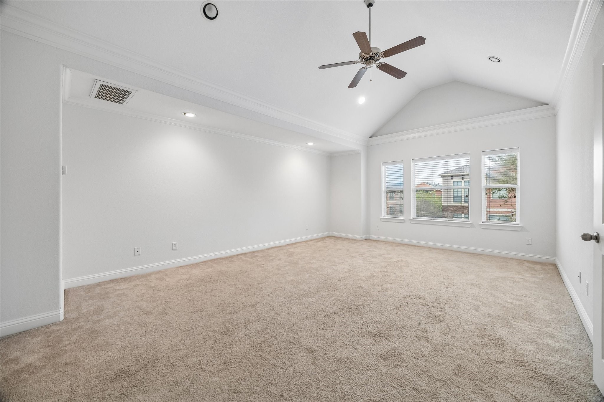 1033 West 23rd Street Houston, TX 77008 - Photo 16 of 25 an empty room with ceiling fan and windows