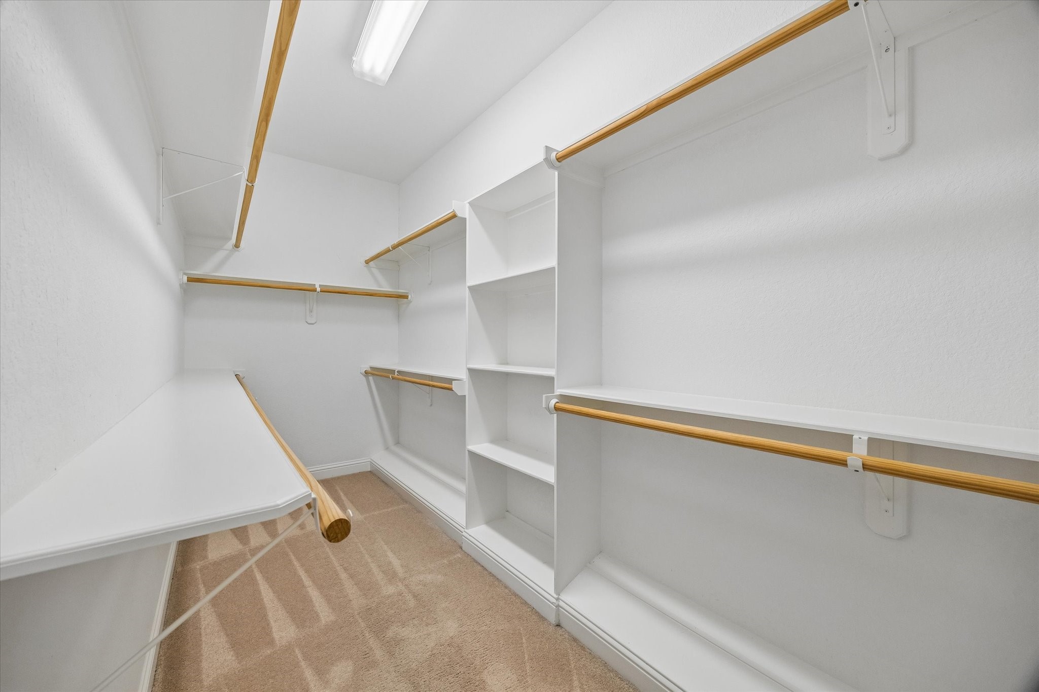 1033 West 23rd Street Houston, TX 77008 - Photo 19 of 25 a view of walk in closet with empty racks