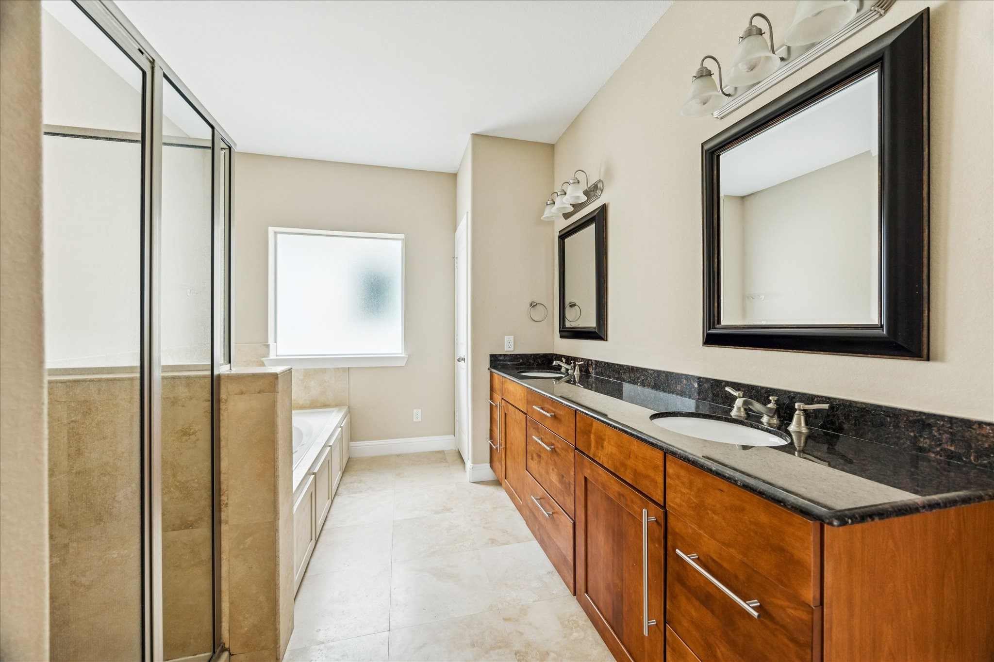1033 West 23rd Street Houston, TX 77008 - Photo 20 of 26 a spacious bathroom with a double vanity sink and a mirror
