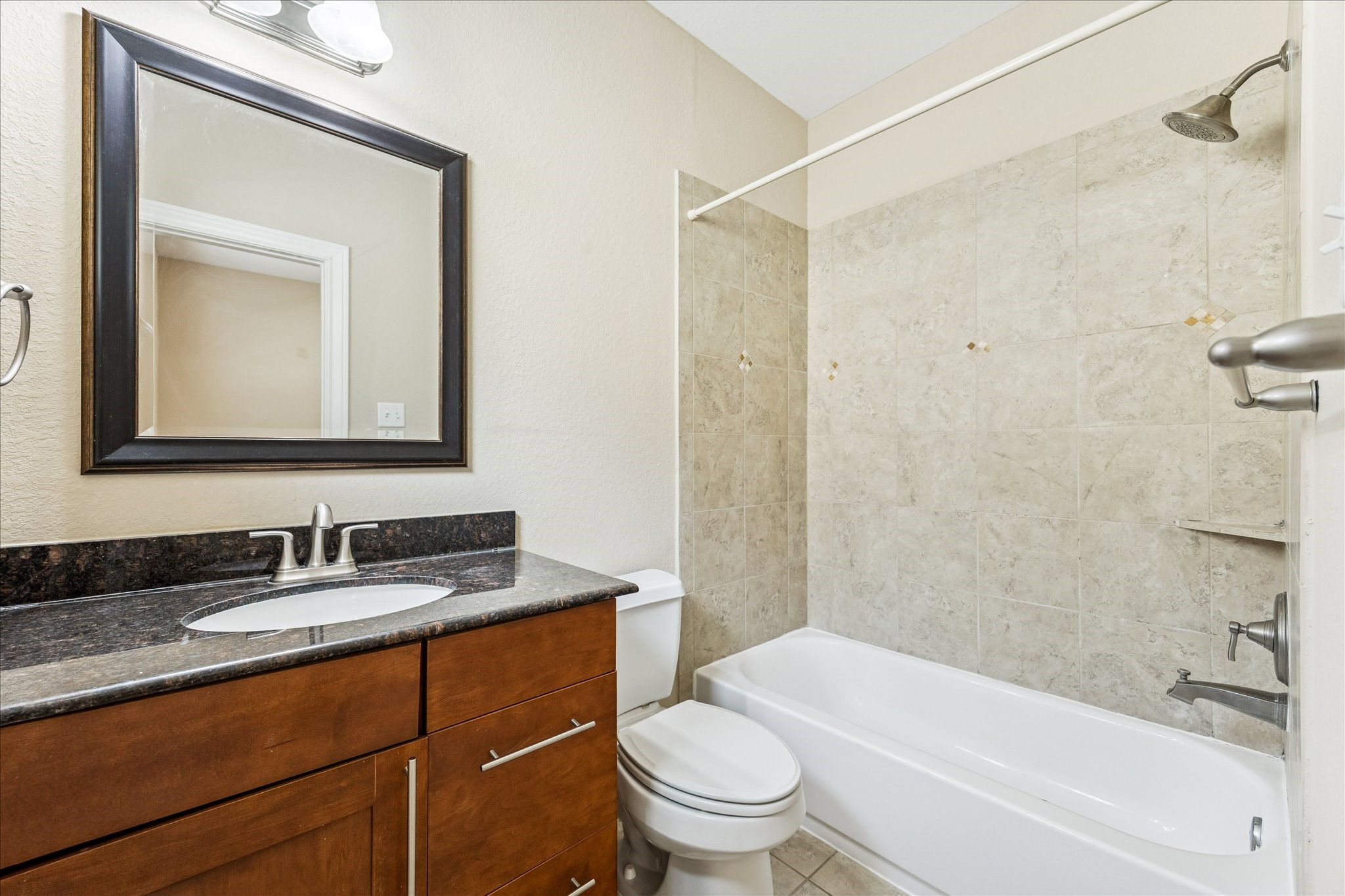 1033 West 23rd Street Houston, TX 77008 - Photo 24 of 26 a bathroom with a toilet sink vanity tub and shower