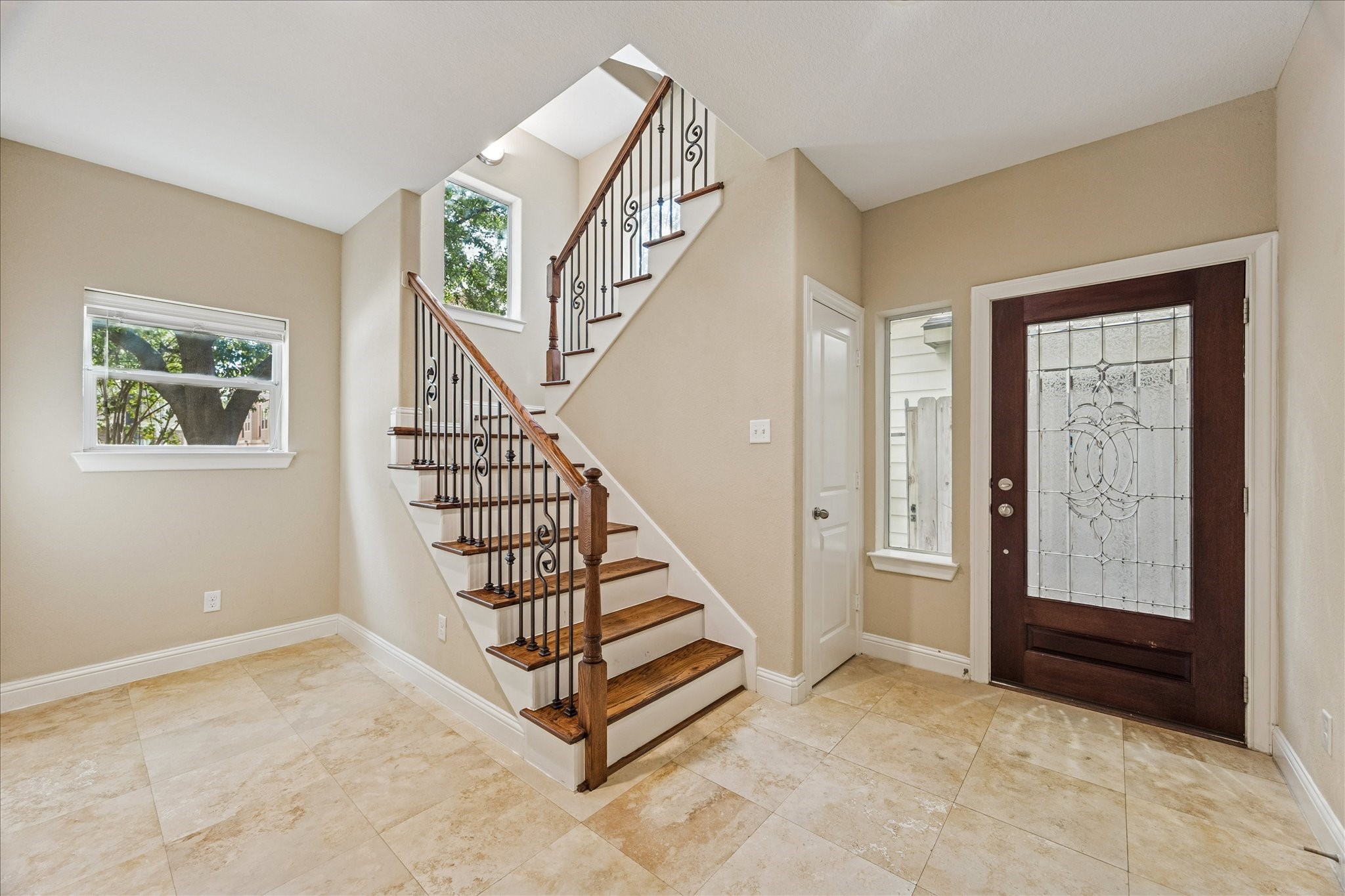 1033 West 23rd Street Houston, TX 77008 - Photo 3 of 26 a view of entryway with stairs and wooden floor