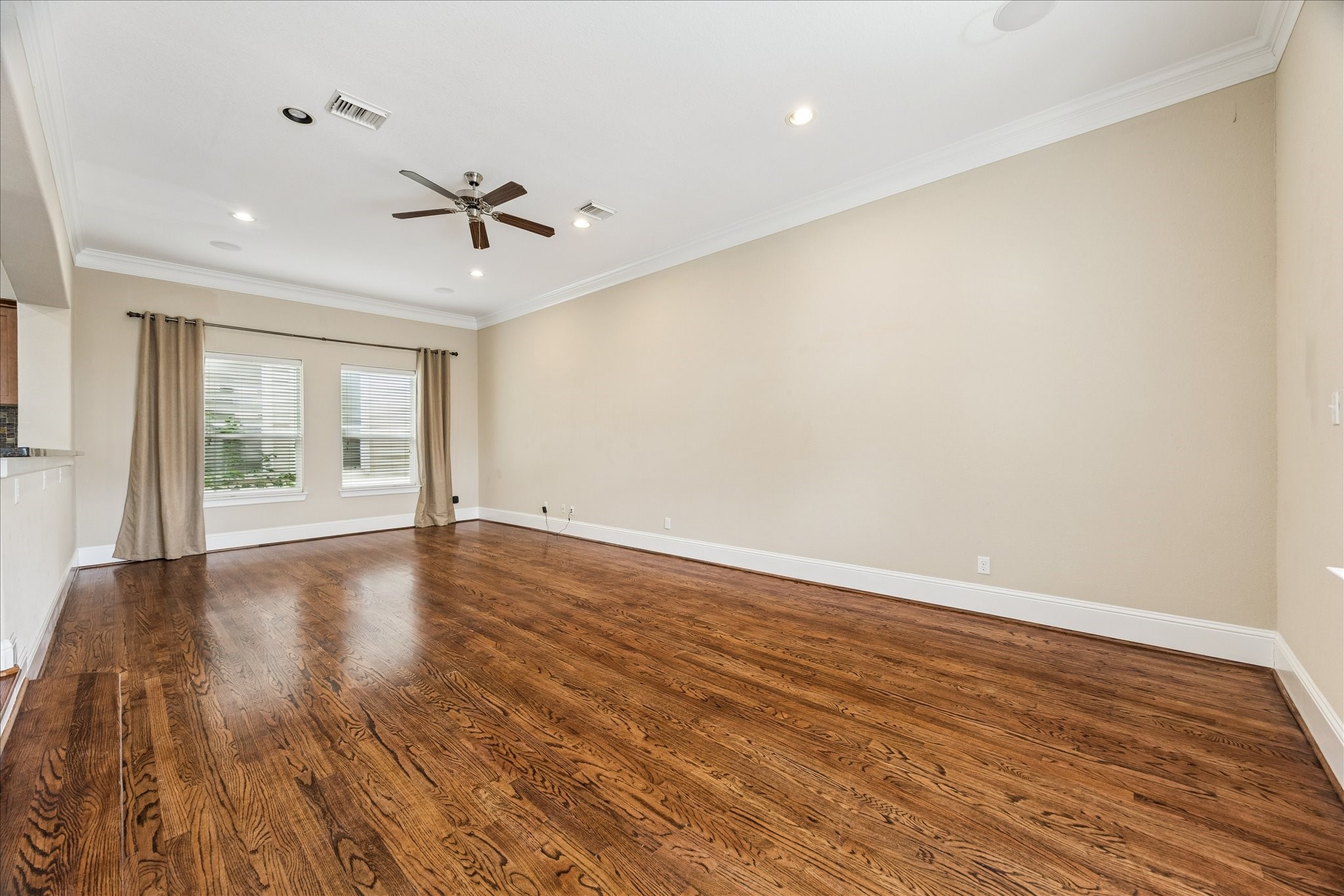 1033 West 23rd Street Houston, TX 77008 - Photo 10 of 26 wooden floor in an empty room with a window