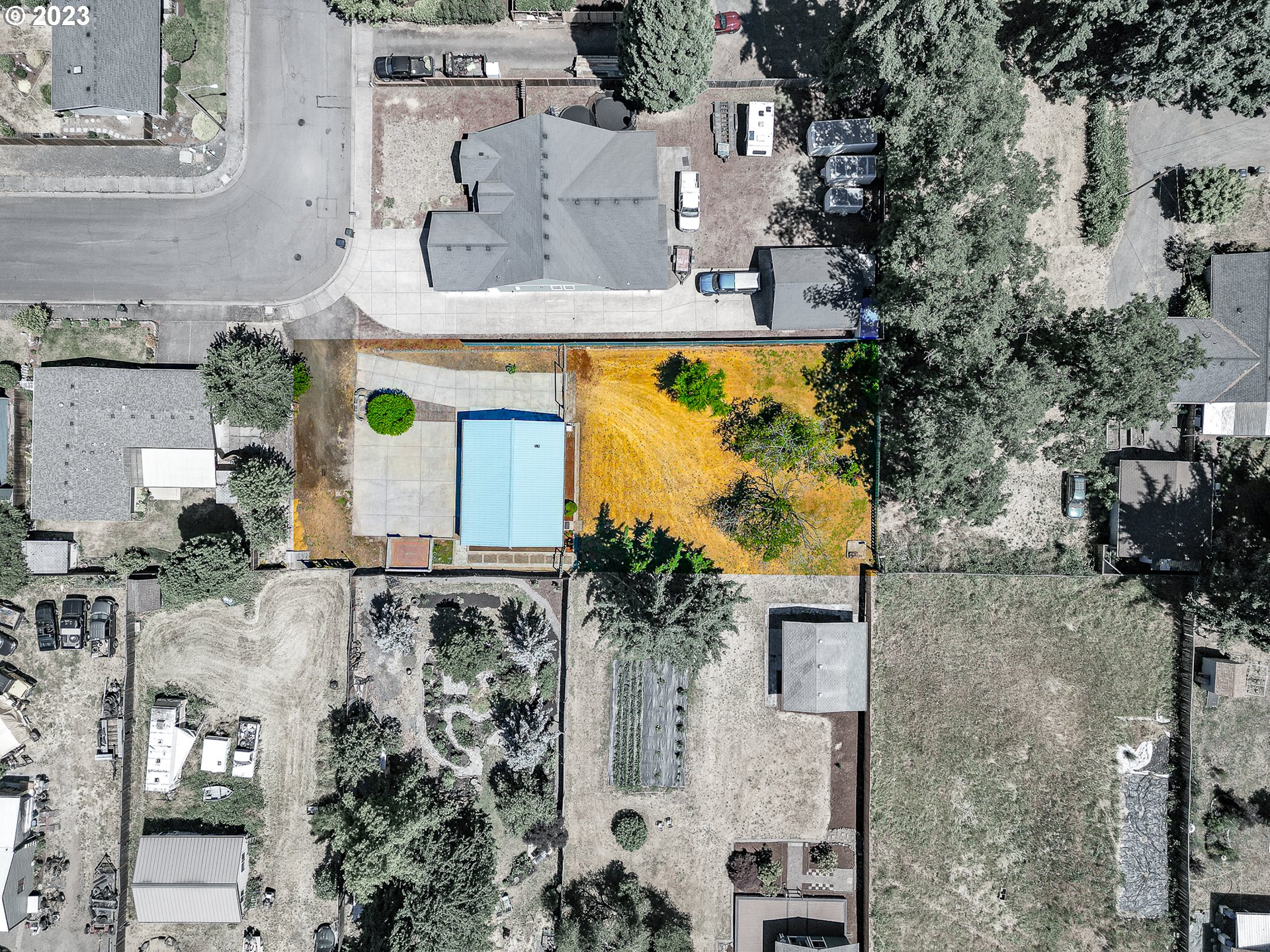 738 West N Street, Unit 2 Springfield, OR 97477 - Photo 9 of 9 an aerial view of residential house with outdoor space and parking