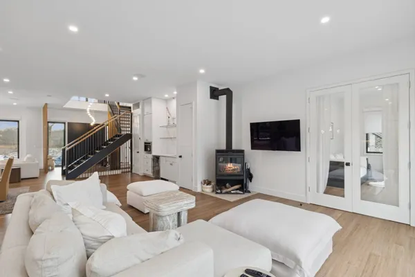 a bedroom with a large bed and a flat screen tv