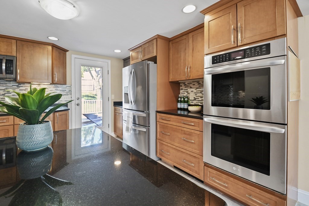 3 Matthew Road Billerica, MA 01821 - Photo 13 of 41 a kitchen with stainless steel appliances a stove cabinets and microwave