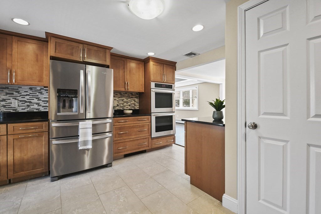 3 Matthew Road Billerica, MA 01821 - Photo 15 of 41 a kitchen with stainless steel appliances a refrigerator and a stove top oven