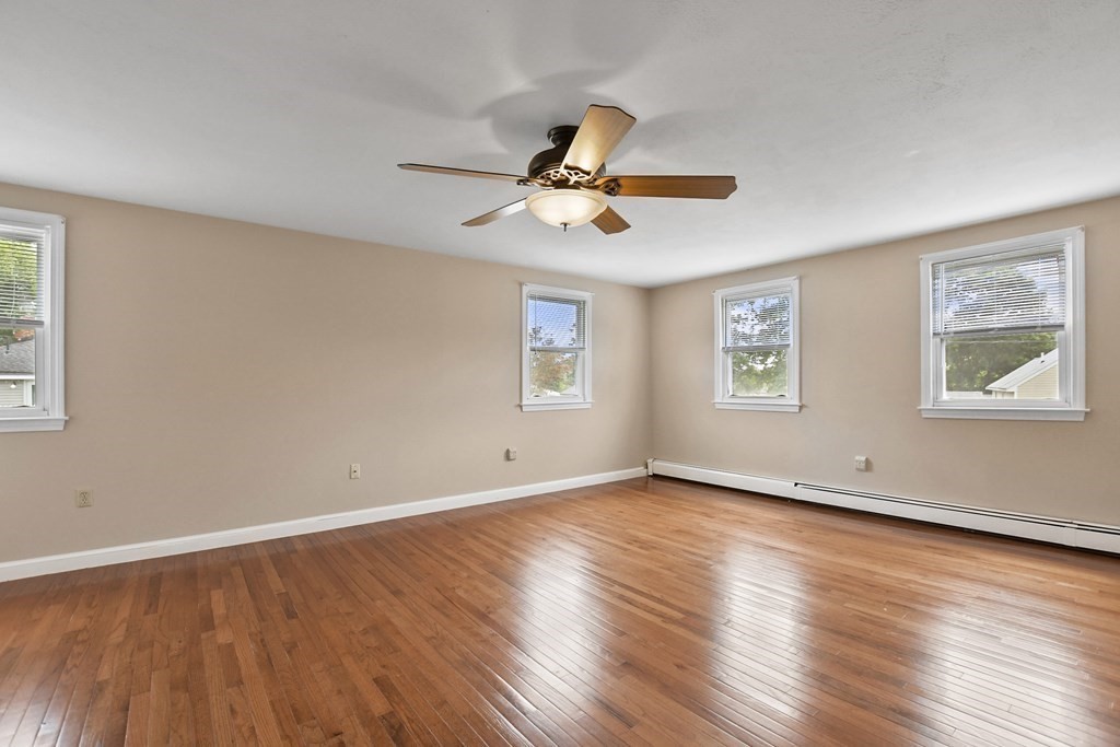 3 Matthew Road Billerica, MA 01821 - Photo 18 of 41 a view of an empty room with window and wooden floor