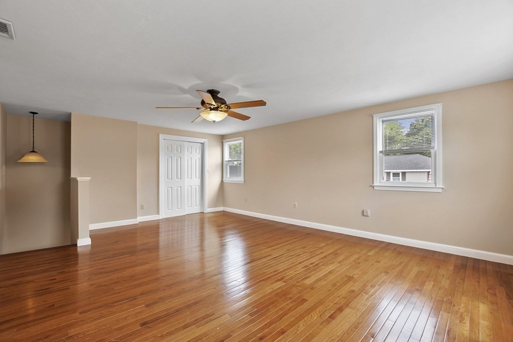 3 Matthew Road Billerica, MA 01821 - Photo 19 of 41 a view of an empty room with wooden floor and a window