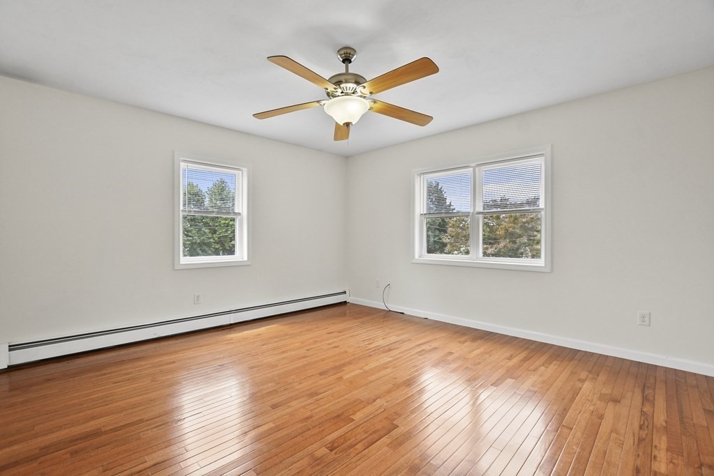 3 Matthew Road Billerica, MA 01821 - Photo 25 of 41 a view of an empty room with wooden floor and a window