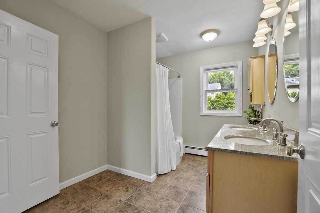 3 Matthew Road Billerica, MA 01821 - Photo 27 of 41 a bathroom with a sink and a mirror