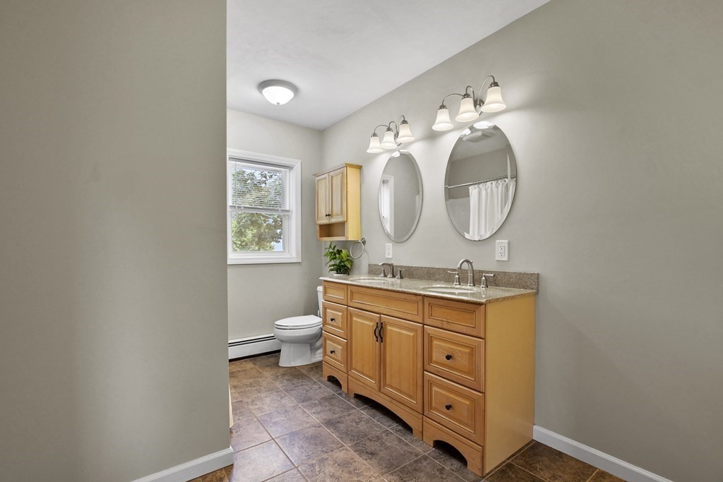 3 Matthew Road Billerica, MA 01821 - Photo 28 of 41 a bathroom with a toilet sink and mirror