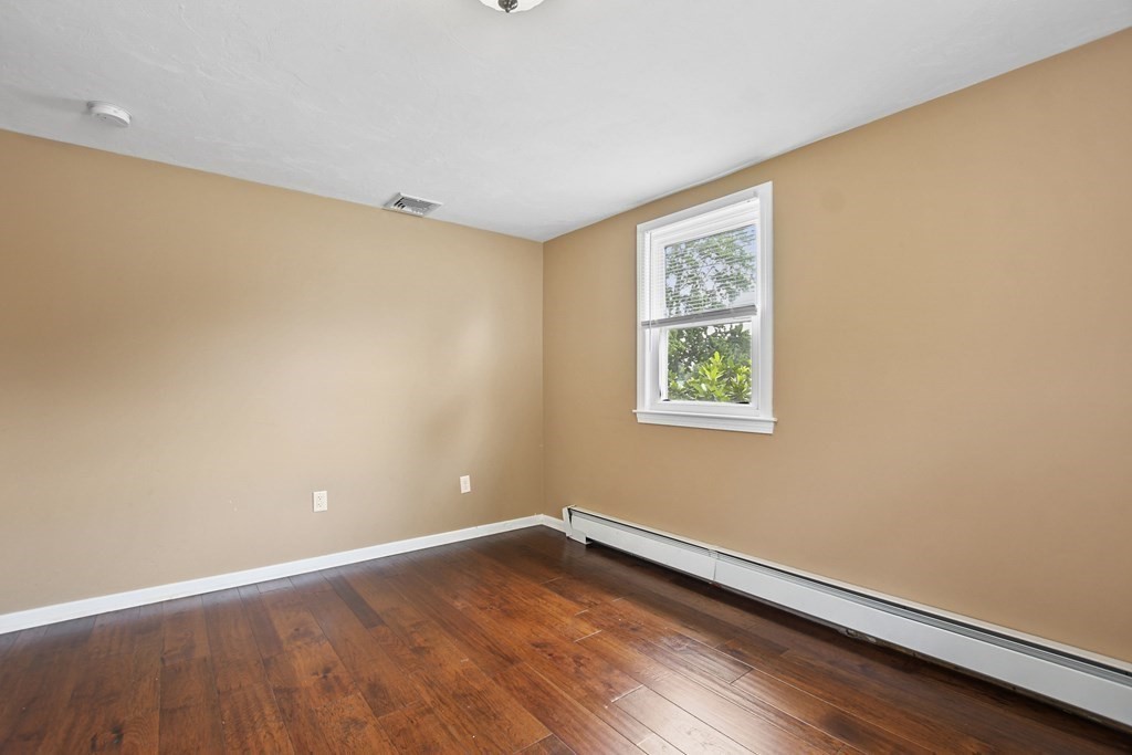 3 Matthew Road Billerica, MA 01821 - Photo 33 of 41 a view of an empty room with wooden floor and a window