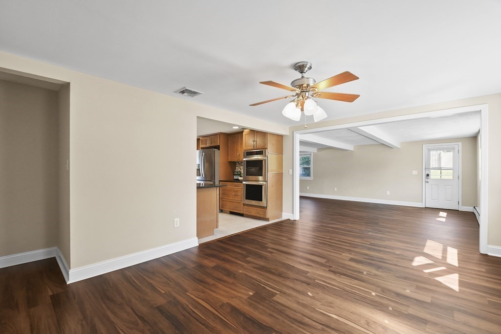 3 Matthew Road Billerica, MA 01821 - Photo 4 of 41 a view of an empty room with window and wooden floor
