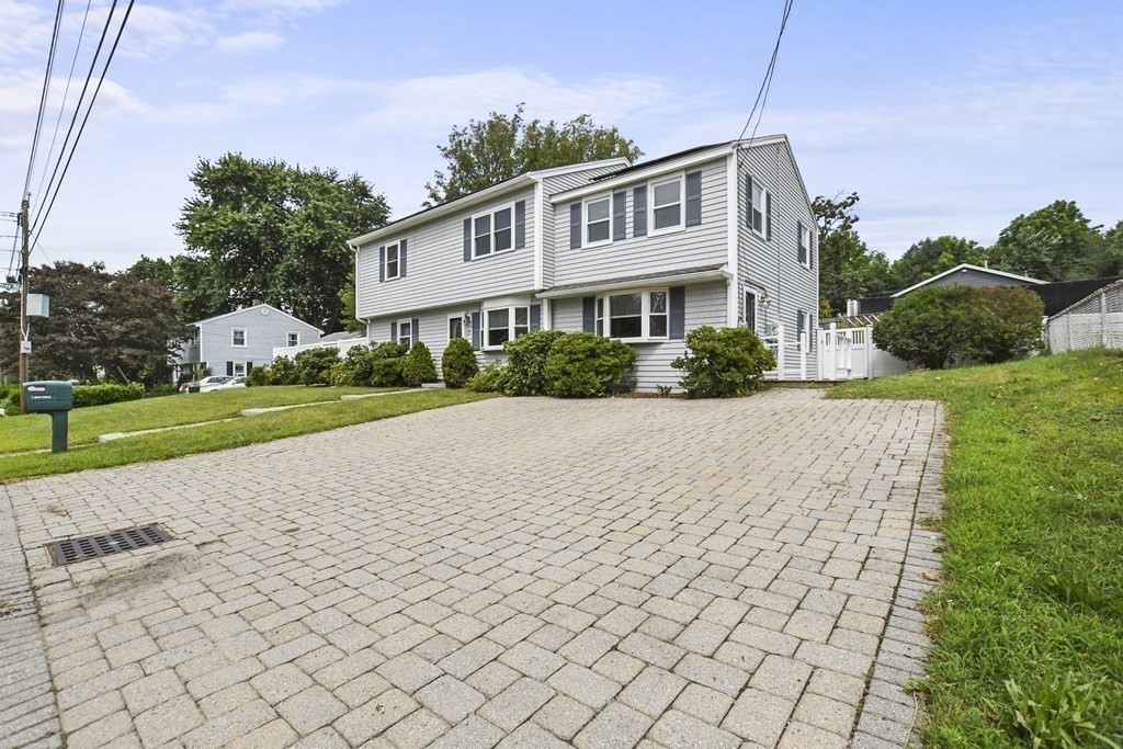 3 Matthew Road Billerica, MA 01821 - Photo 41 of 41 a front view of a house with a yard and garage