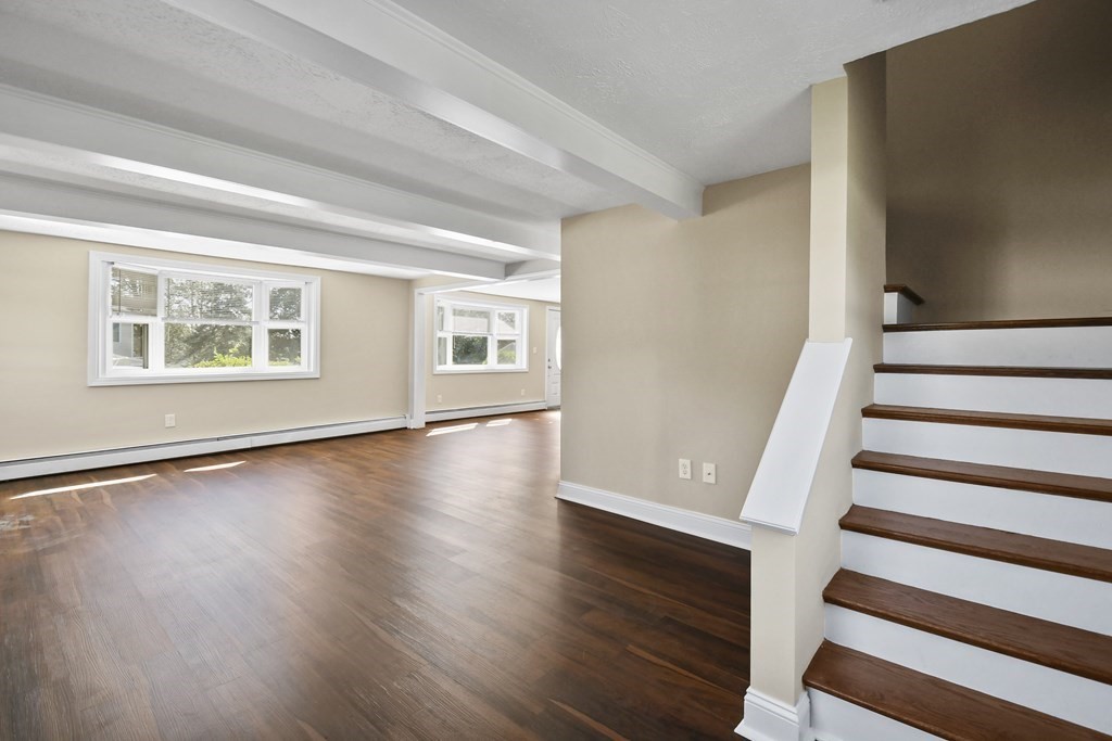 3 Matthew Road Billerica, MA 01821 - Photo 10 of 41 a view of an empty room with wooden floor and a window