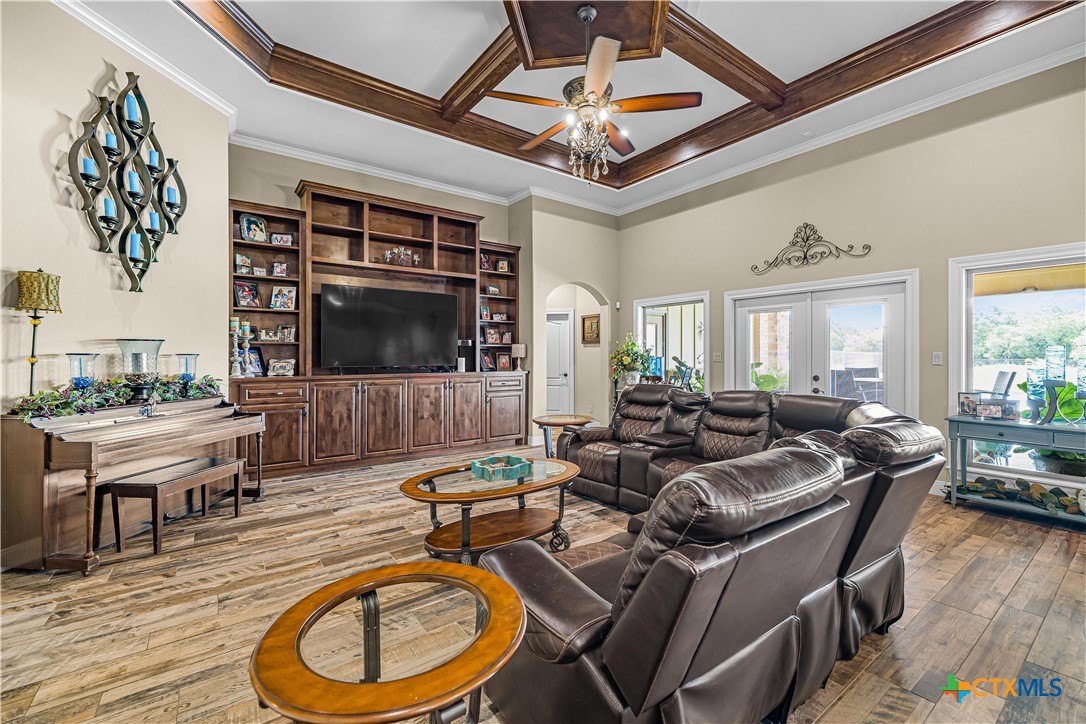 254 Sendera Loop Victoria, TX 77904 - Photo 19 of 48 a living room with furniture a rug and a flat screen tv