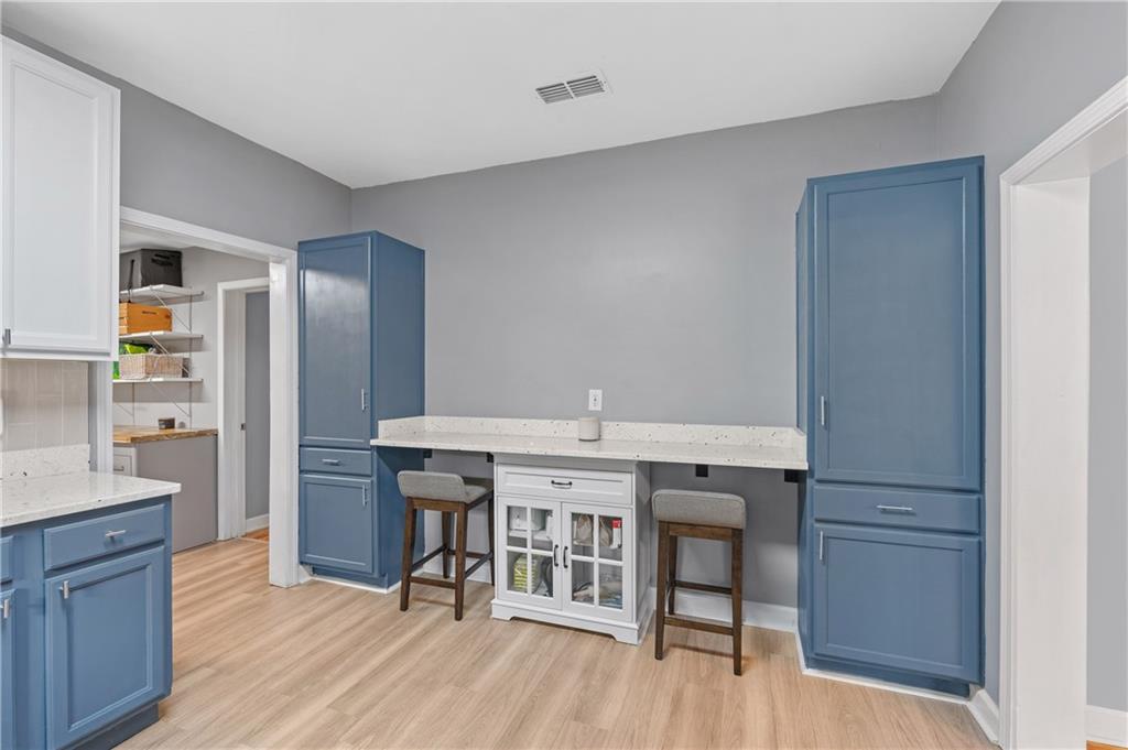 4748 Fowler Circle Acworth, GA 30101 - Photo 14 of 27 a view of kitchen with center island and wooden floor