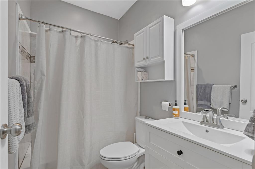 4748 Fowler Circle Acworth, GA 30101 - Photo 21 of 27 a bathroom with a sink a toilet and shower