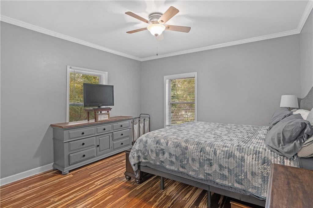 4748 Fowler Circle Acworth, GA 30101 - Photo 22 of 27 a bedroom with a bed and a dresser in it