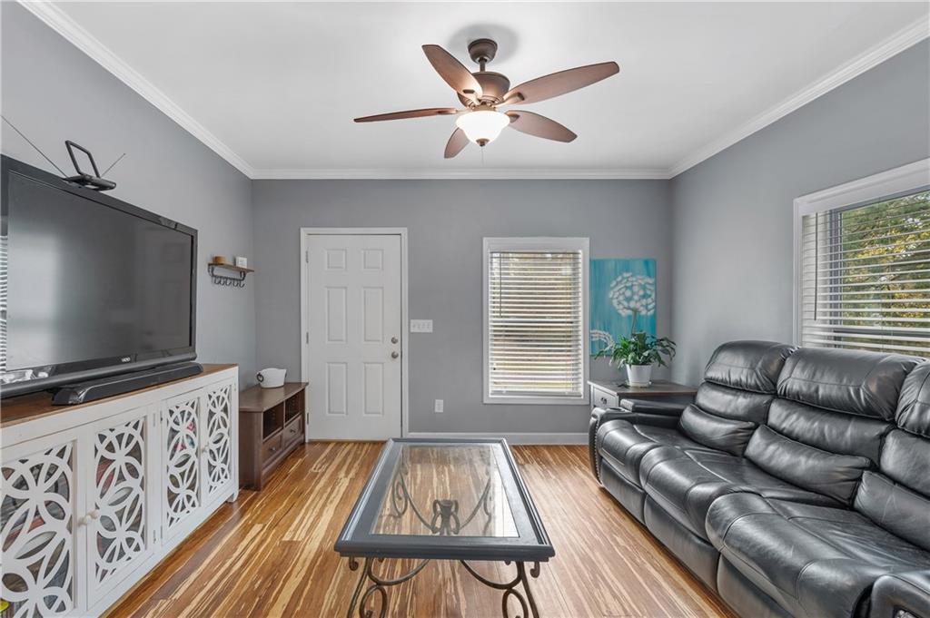 4748 Fowler Circle Acworth, GA 30101 - Photo 5 of 27 a living room with furniture and a flat screen tv