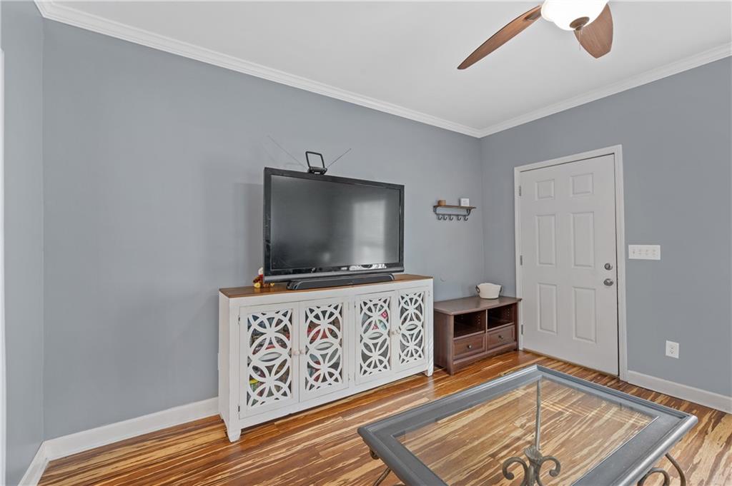 4748 Fowler Circle Acworth, GA 30101 - Photo 6 of 27 a living room with furniture and a flat screen tv